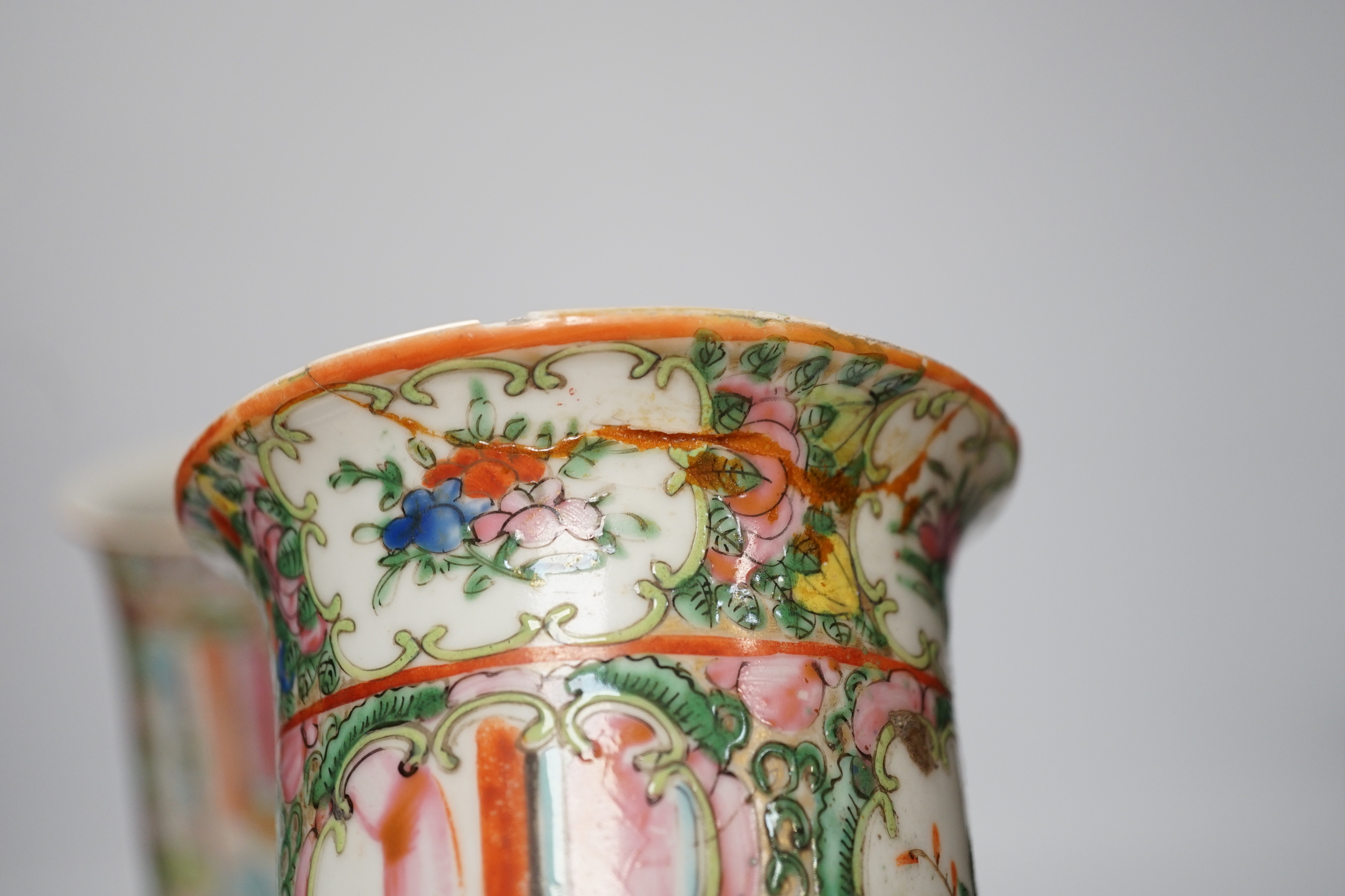 A pair of 19th century Chinese famille rose sleeve vases and a pair of 18th century Chinese blue and white plates, vases 26.5cm